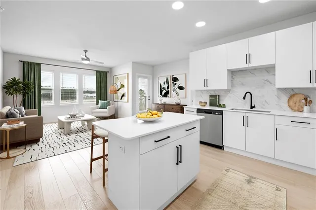 a kitchen with a sink stove and cabinets