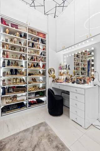 an empty room with a bed and a window