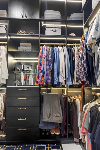 a bedroom with two beds and a chandelier