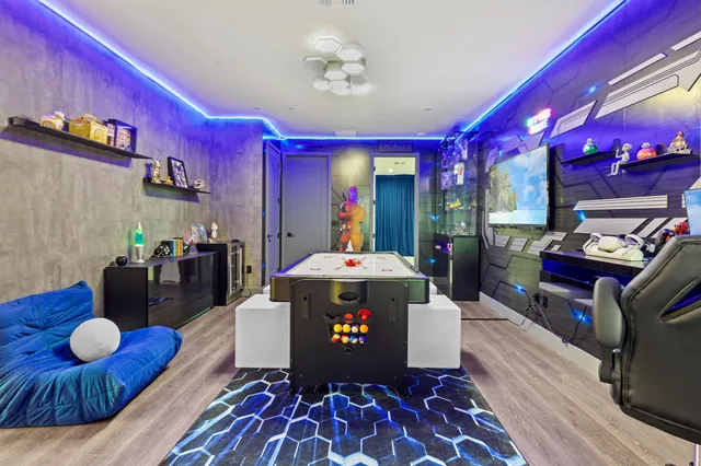 a view of a dining room with furniture wooden floor and chandelier