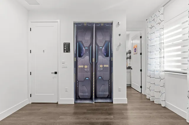 a view of a house with backyard porch and sitting area