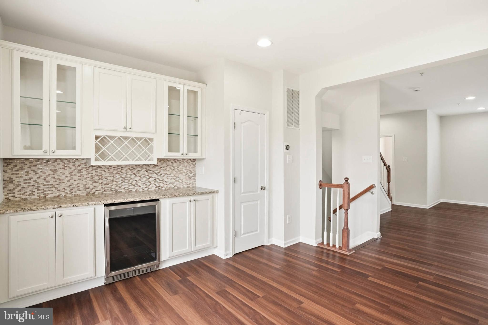 9817 Solar Course Laurel, MD 20723 - Photo 10 of 59 a kitchen with granite countertop a stove and a sink