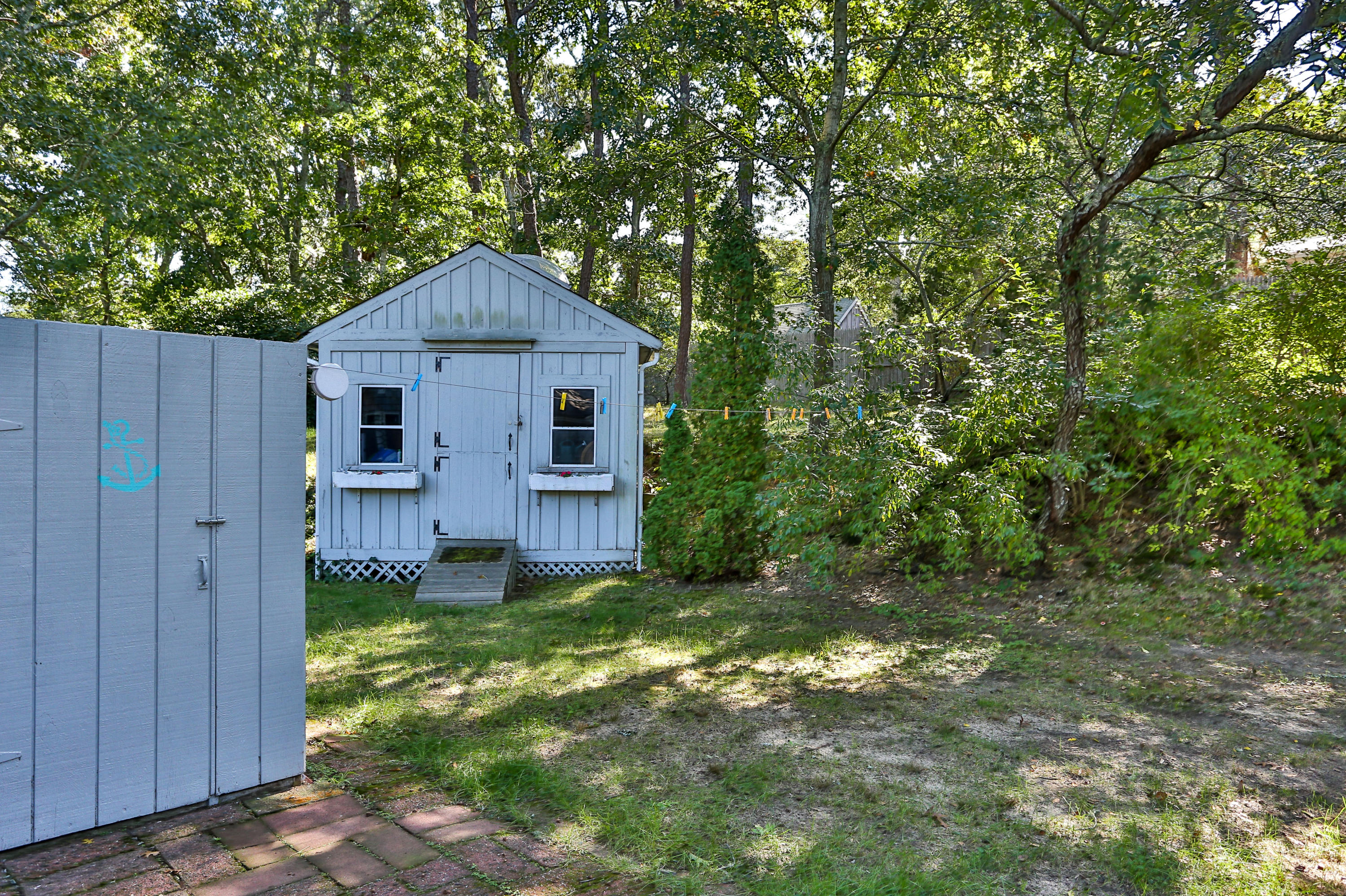65 Steele Road Eastham, MA 02642 - Photo 17 of 26 Outdoor Shower and Large Shed