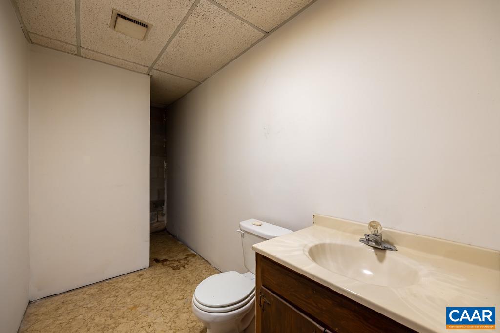 9 Old Durrette Road Stanardsville, VA 22973 - Photo 23 of 46 a bathroom with a sink toilet and a mirror