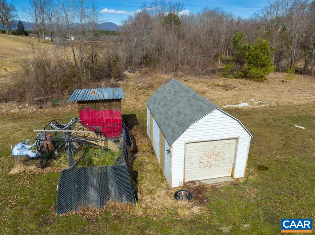 9 Old Durrette Road Stanardsville, VA 22973 - Photo 39 of 46 a view of a wooden house with a yard