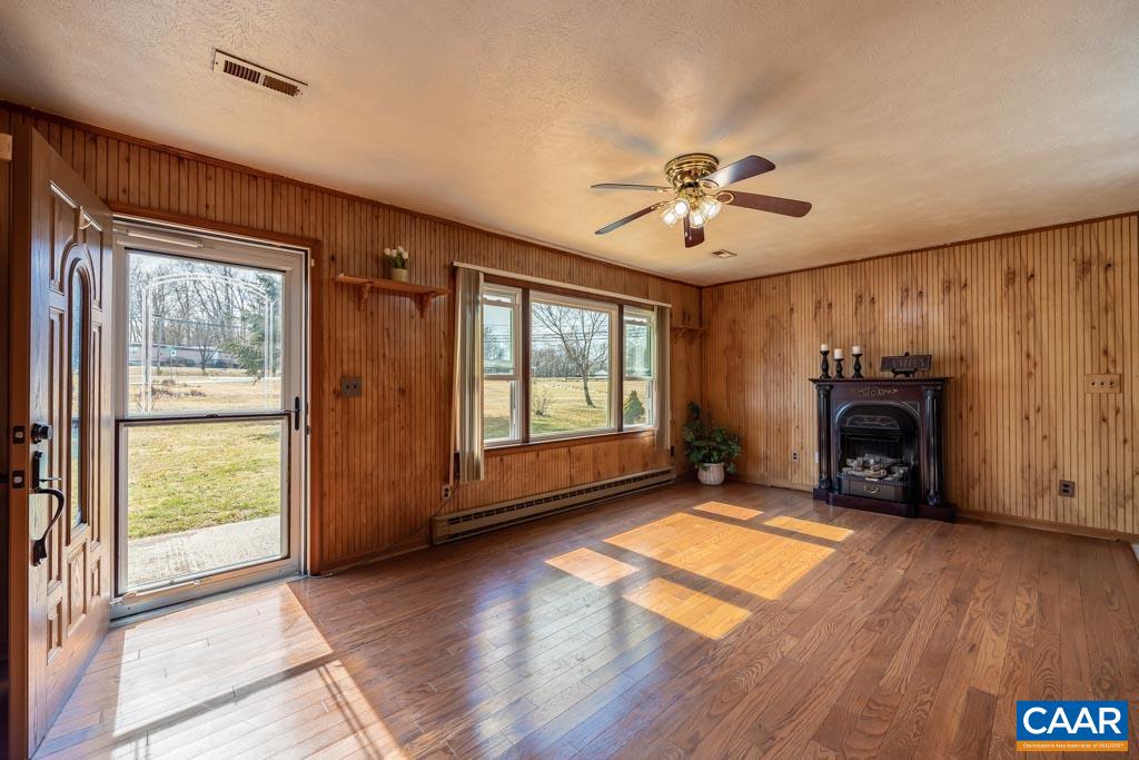 9 Old Durrette Road Stanardsville, VA 22973 - Photo 4 of 46 a view of an empty room with window fireplace and wooden floor