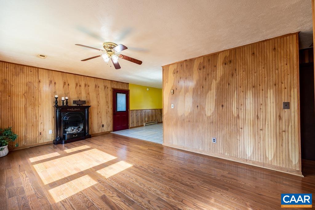 9 Old Durrette Road Stanardsville, VA 22973 - Photo 5 of 46 a view of a livingroom with a ceiling fan window and a ceiling fan