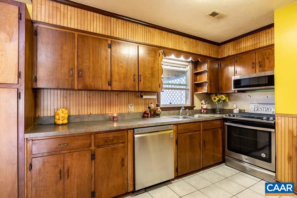 9 Old Durrette Road Stanardsville, VA 22973 - Photo 8 of 46 a kitchen with stainless steel appliances granite countertop a sink stove and cabinets