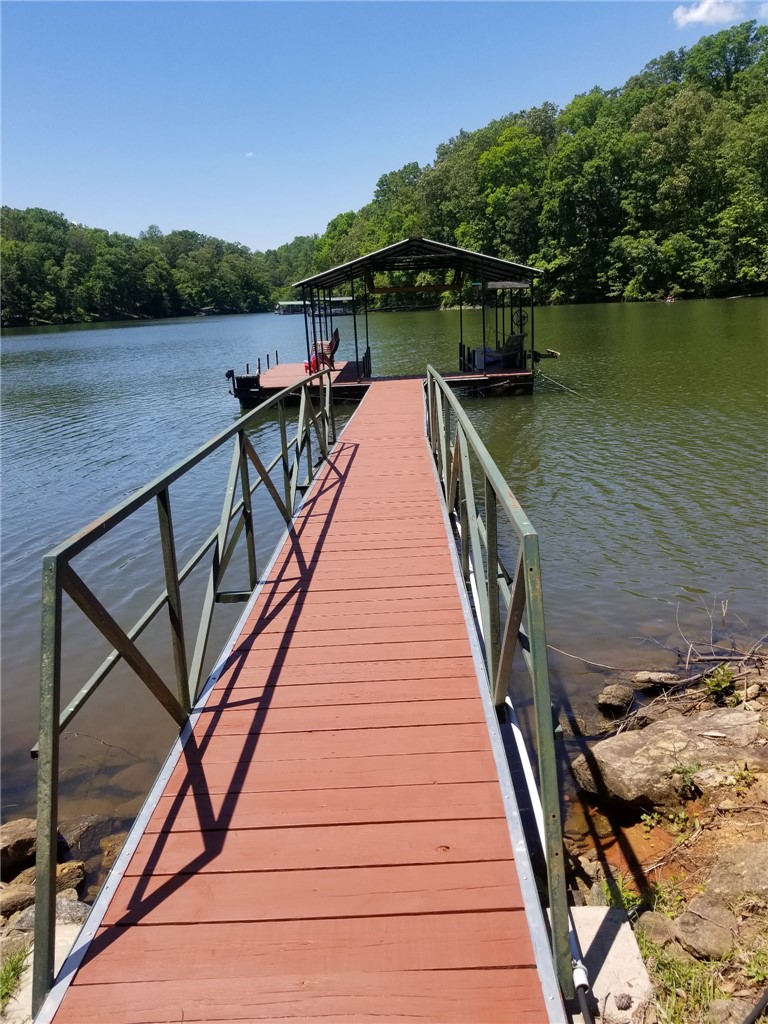 110 Snug Harbor Road Seneca, SC 29678 - Photo 34 of 37 This private dock extends into serene waters, offering direct access for leisure and enjoyment. Picture taken at full pond.