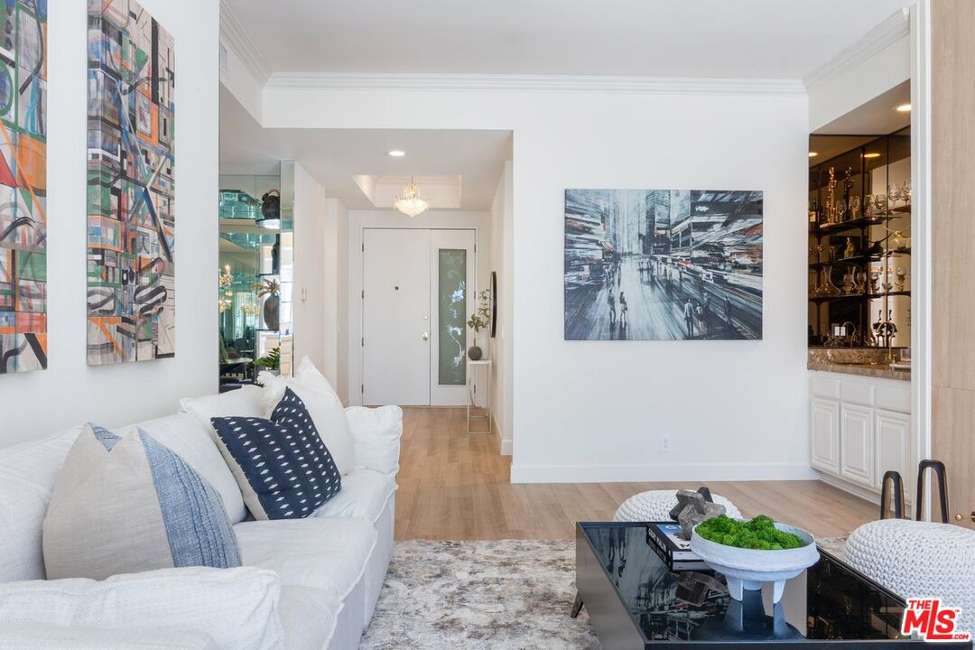 457 North Doheny Drive, Unit 304 Beverly Hills, CA 90210 - Photo 2 of 32 a living room with furniture and wooden floor