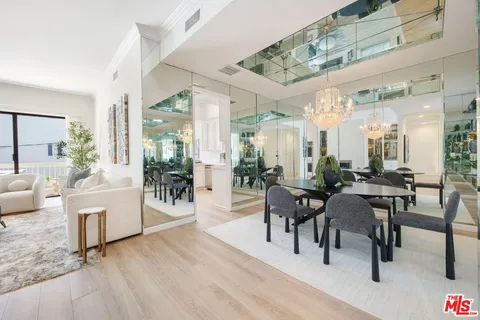 a view of a livingroom with furniture and a table