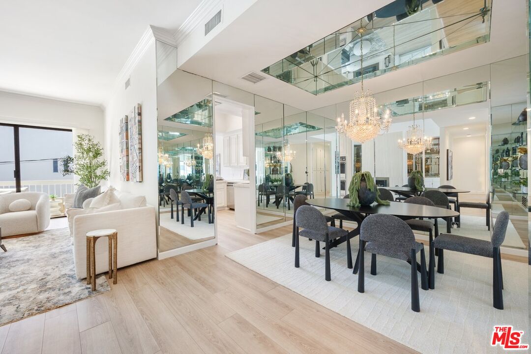 457 North Doheny Drive, Unit 304 Beverly Hills, CA 90210 - Photo 7 of 32 a view of a livingroom with furniture and a table