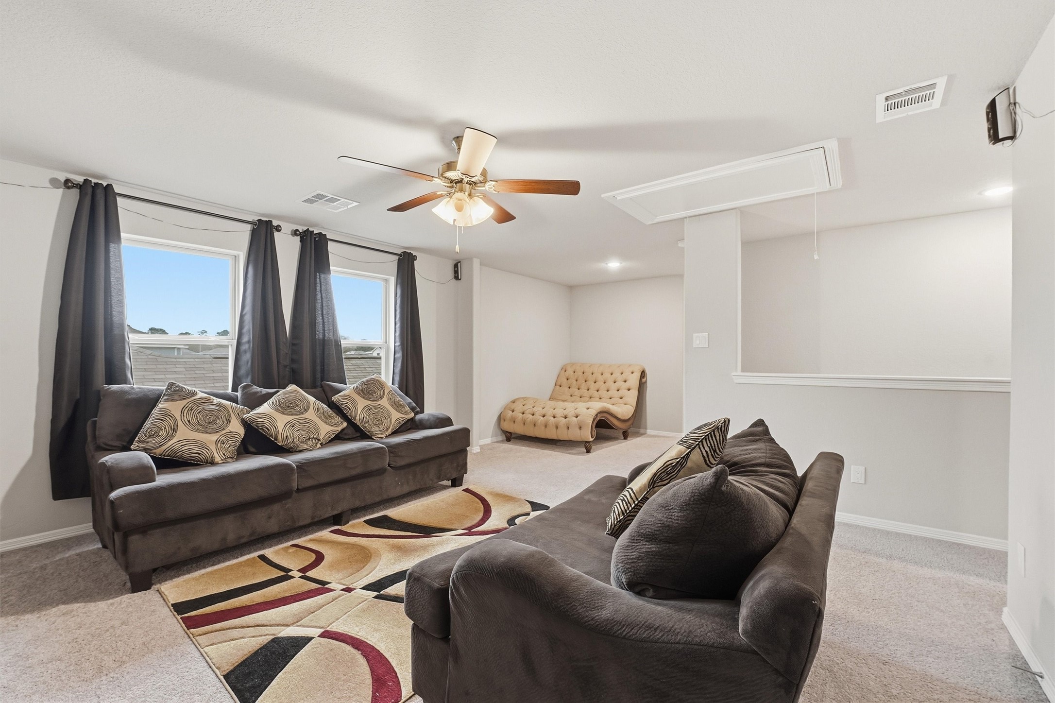 24818 Russet Bluff Trail Houston, TX 77336 - Photo 13 of 23 a living room with furniture ceiling fan and a rug