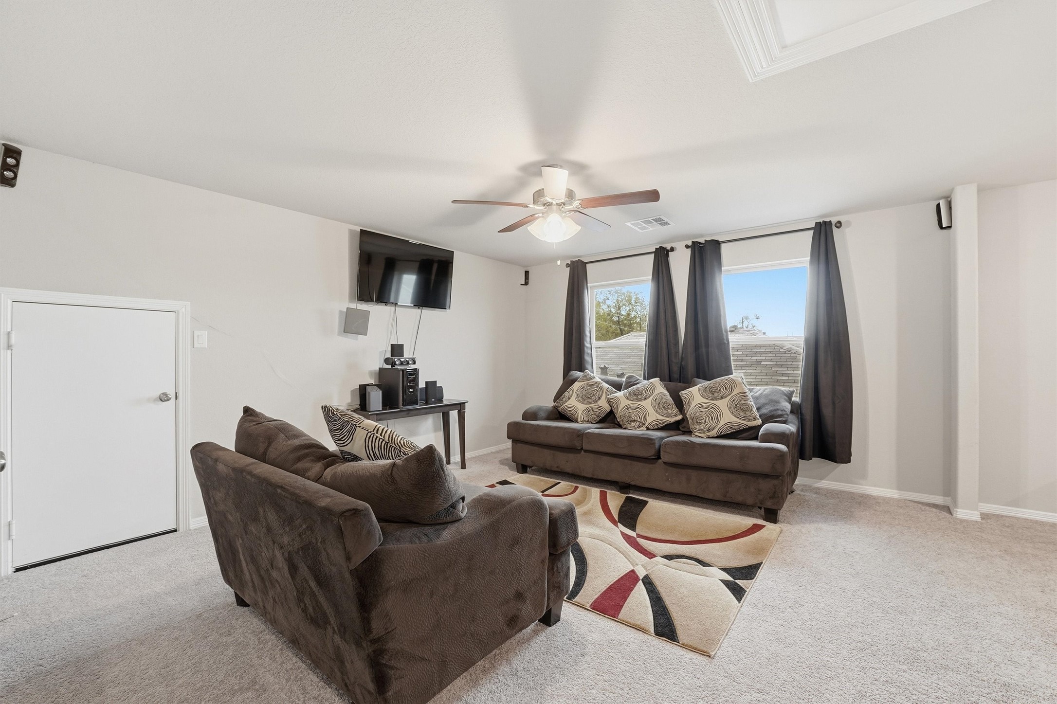 24818 Russet Bluff Trail Houston, TX 77336 - Photo 14 of 23 a living room with furniture and a flat screen tv