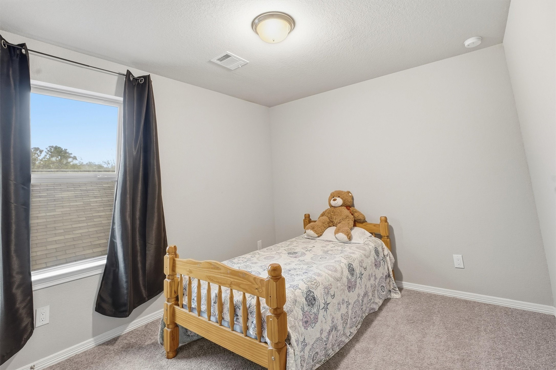 24818 Russet Bluff Trail Houston, TX 77336 - Photo 15 of 23 a bedroom with a bed and a window