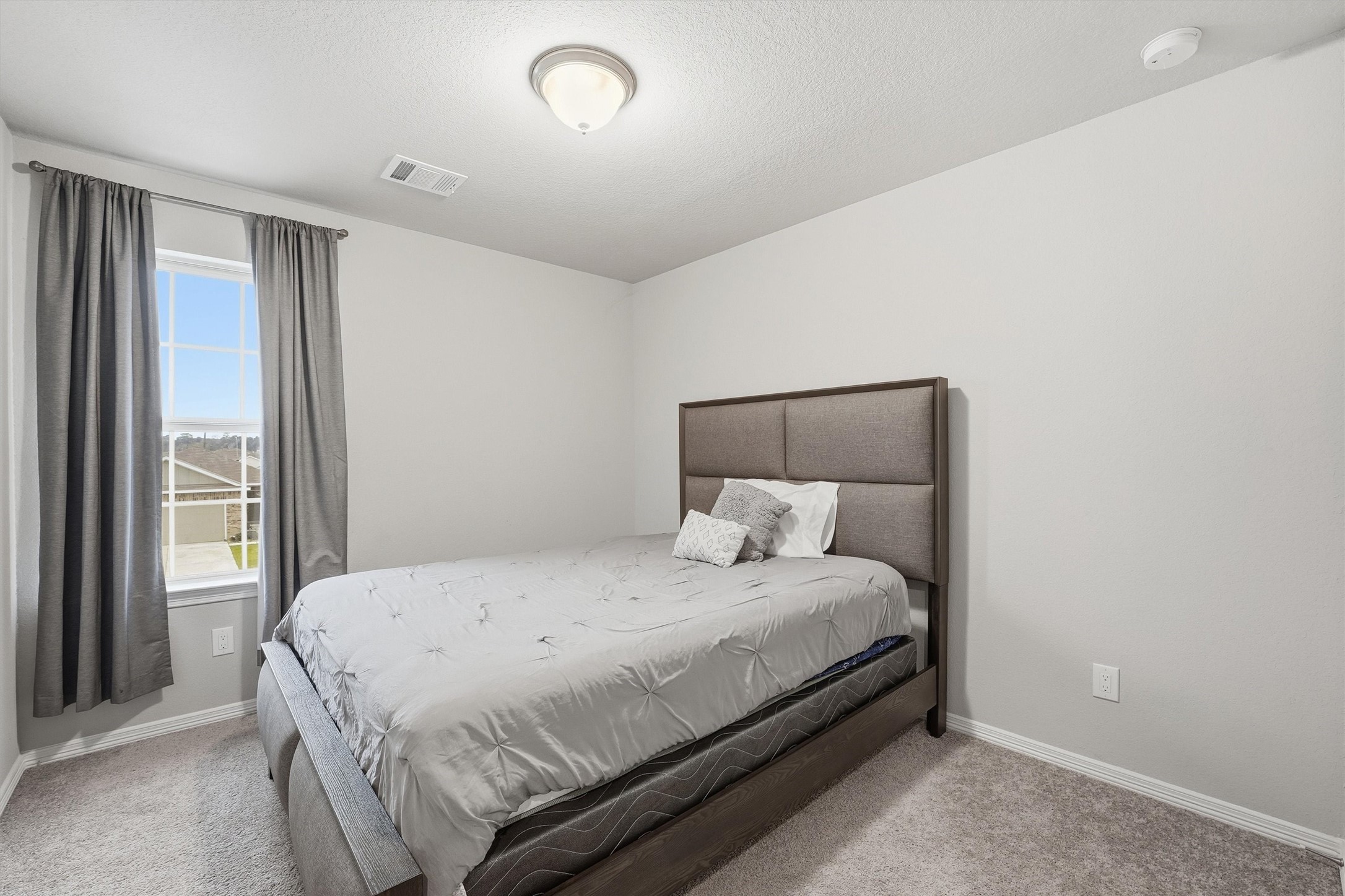 24818 Russet Bluff Trail Houston, TX 77336 - Photo 17 of 23 a bedroom with a bed and a window