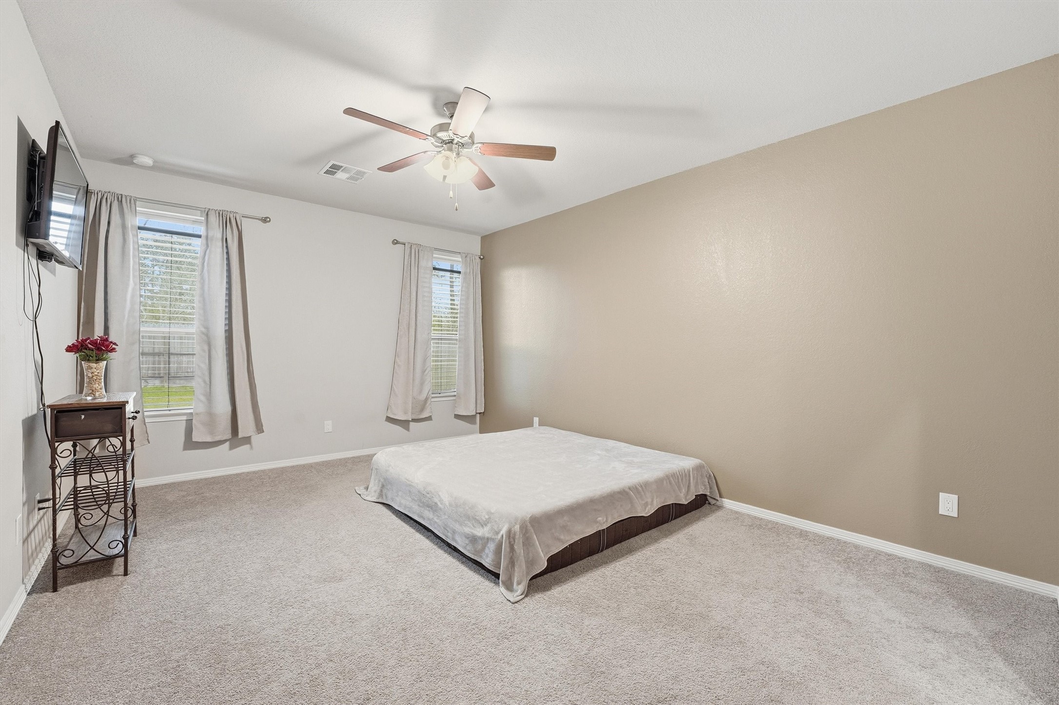 24818 Russet Bluff Trail Houston, TX 77336 - Photo 19 of 23 a spacious bedroom with a bed and window