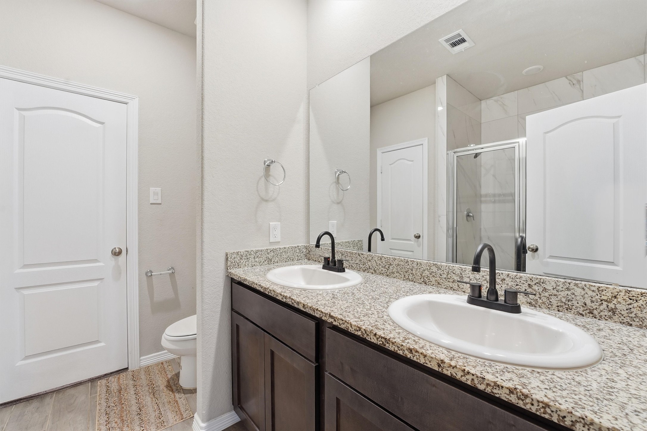 24818 Russet Bluff Trail Houston, TX 77336 - Photo 20 of 23 a bathroom with a granite countertop sink and a mirror