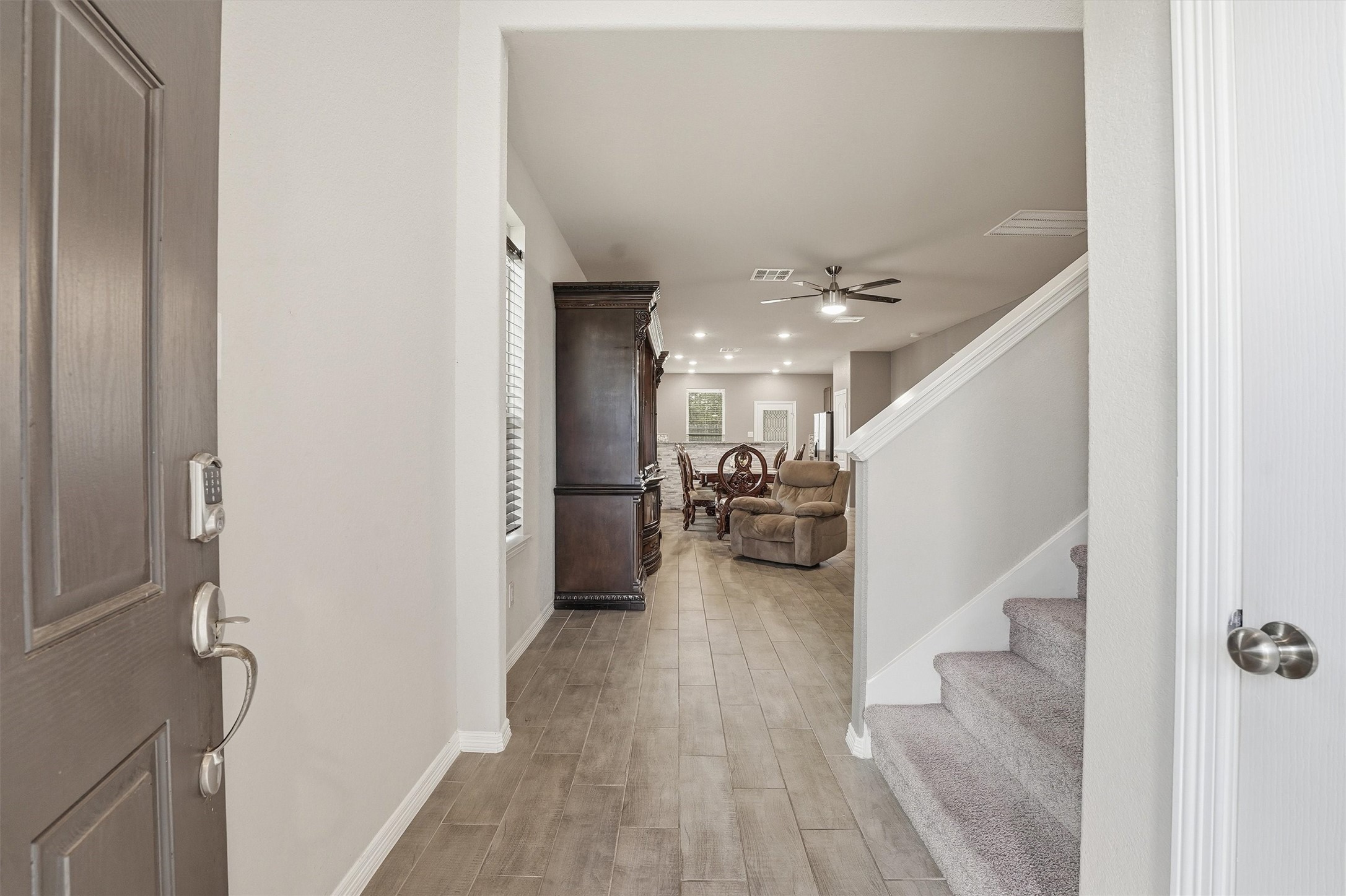24818 Russet Bluff Trail Houston, TX 77336 - Photo 3 of 23 a view of a hallway with furniture and a livingroom