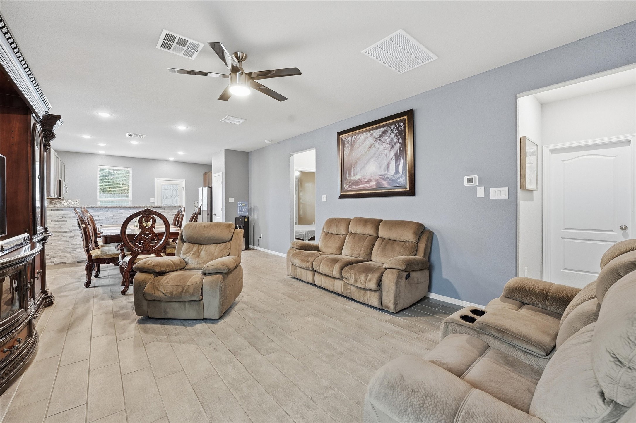 24818 Russet Bluff Trail Houston, TX 77336 - Photo 4 of 23 a living room with furniture and a ceiling fan