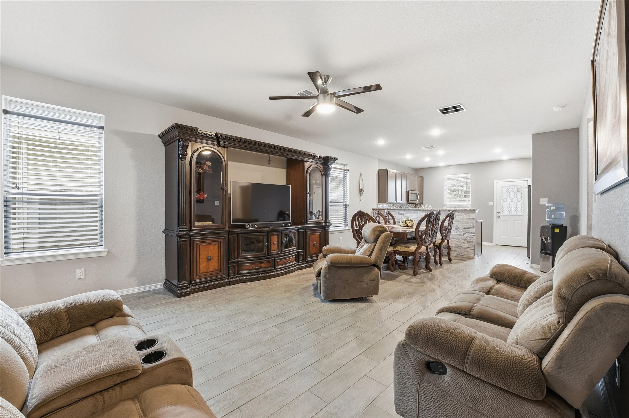 24818 Russet Bluff Trail Houston, TX 77336 - Photo 5 of 23 a living room with furniture and a flat screen tv