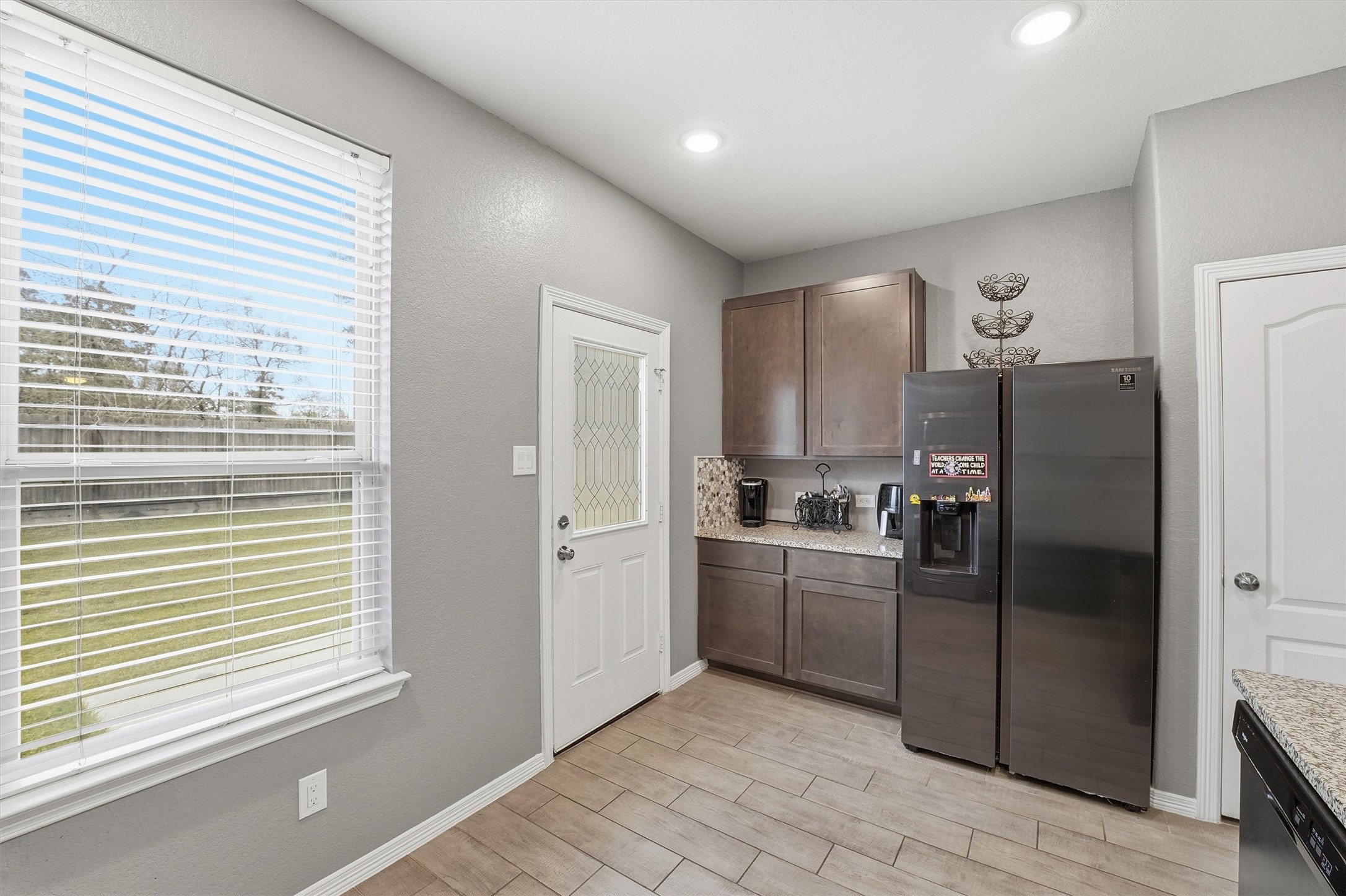 24818 Russet Bluff Trail Houston, TX 77336 - Photo 10 of 23 a kitchen with stainless steel appliances granite countertop a refrigerator and a sink
