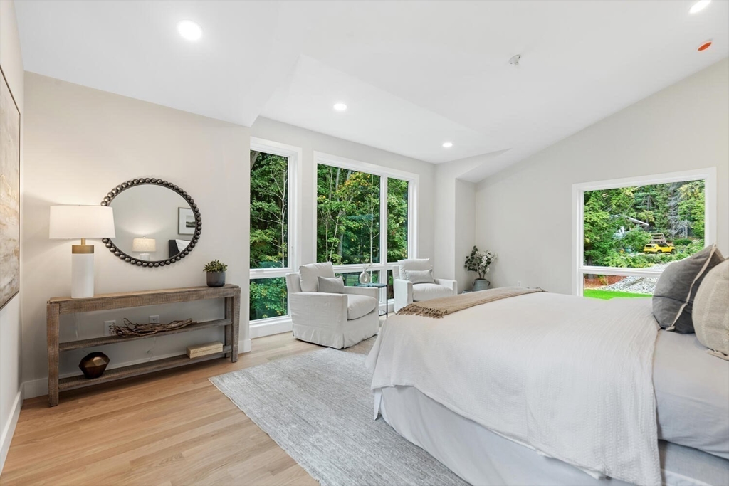 6 Linc Cole Lane Lexington, MA 02421 - Photo 19 of 30 a bedroom with a large bed and windows