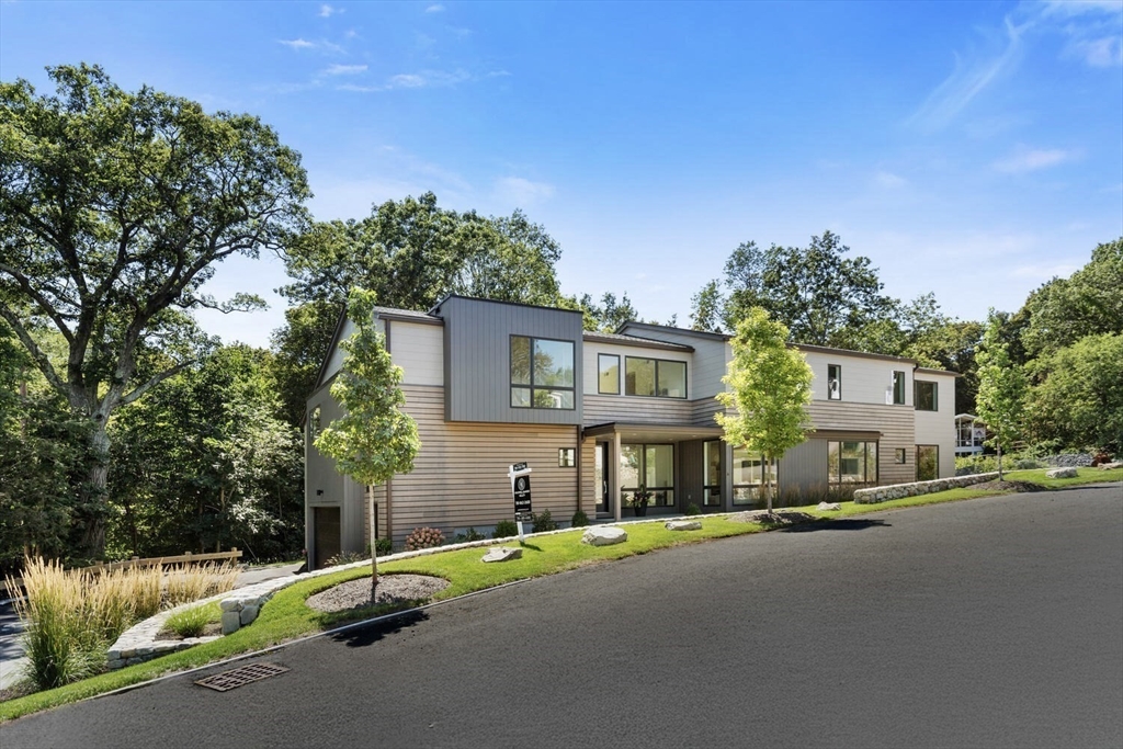 6 Linc Cole Lane Lexington, MA 02421 - Photo 2 of 30 a front view of a house with a yard and garage