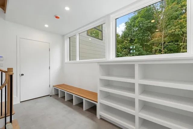 a view of room with window and furniture