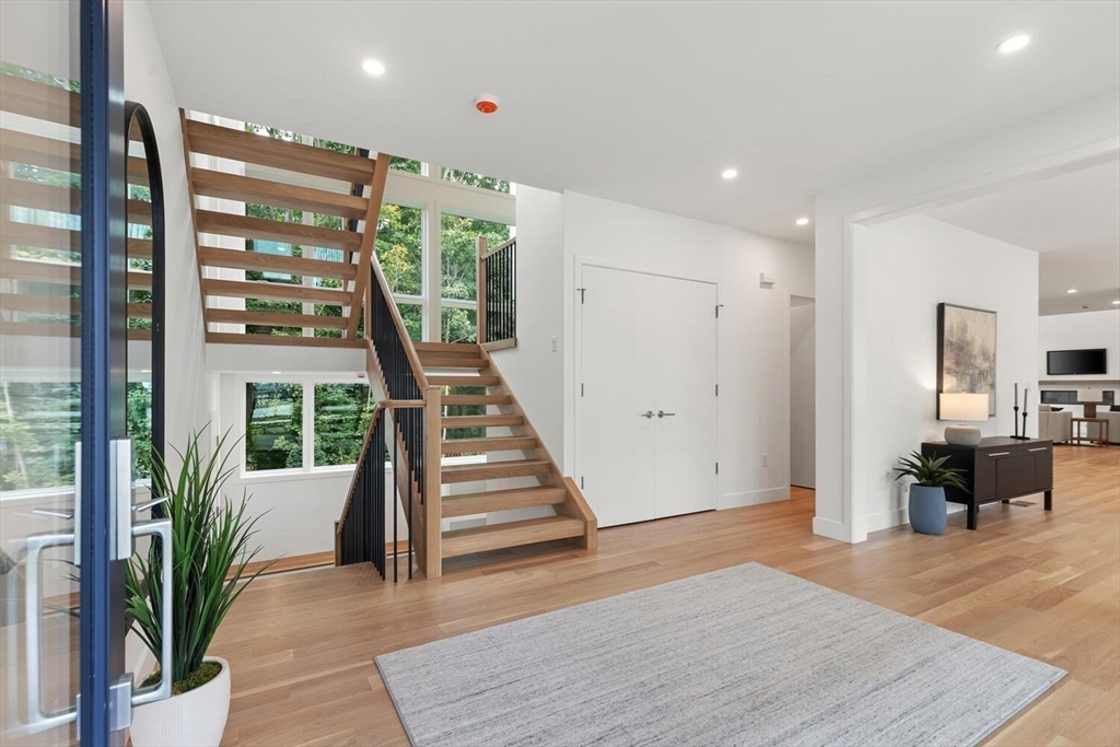 6 Linc Cole Lane Lexington, MA 02421 - Photo 4 of 30 an empty room with wooden floor and windows