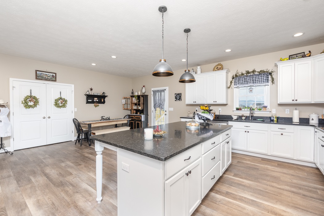 115 Ridgemore Drive Raphine, VA 24472 - Photo 12 of 42 a large kitchen with stainless steel appliances granite countertop a stove and a sink