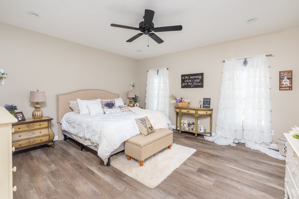 115 Ridgemore Drive Raphine, VA 24472 - Photo 21 of 42 a bedroom with a bed and a chandelier