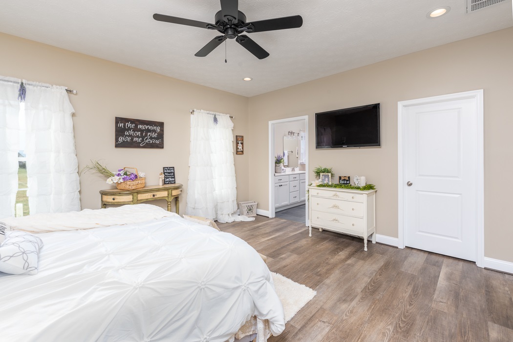 115 Ridgemore Drive Raphine, VA 24472 - Photo 24 of 42 a bedroom with a bed and a flat screen tv