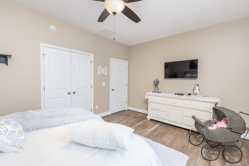 115 Ridgemore Drive Raphine, VA 24472 - Photo 30 of 42 a room with a bed and a flat screen tv