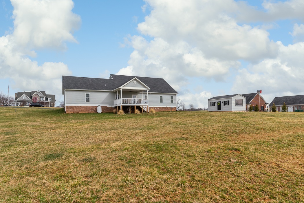 115 Ridgemore Drive Raphine, VA 24472 - Photo 5 of 42 a front view of house with yard and ocean