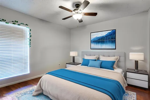 a bedroom with bed and a chandelier