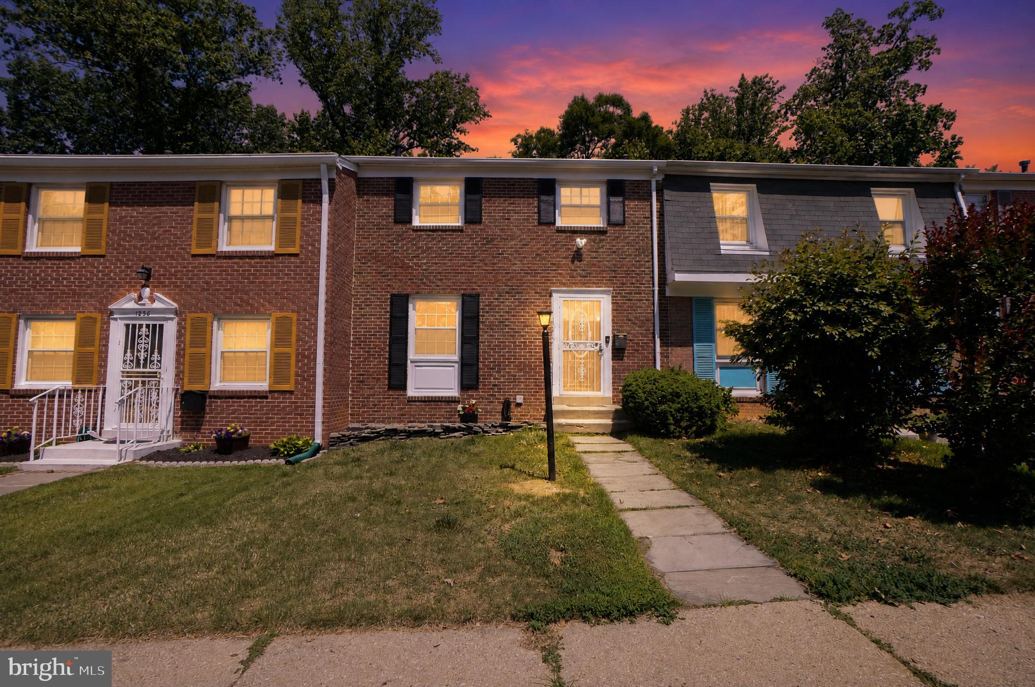 1232 Palmer Road, Unit 111 Fort Washington, MD 20744 - Photo 5 of 45 a front view of a house with a yard