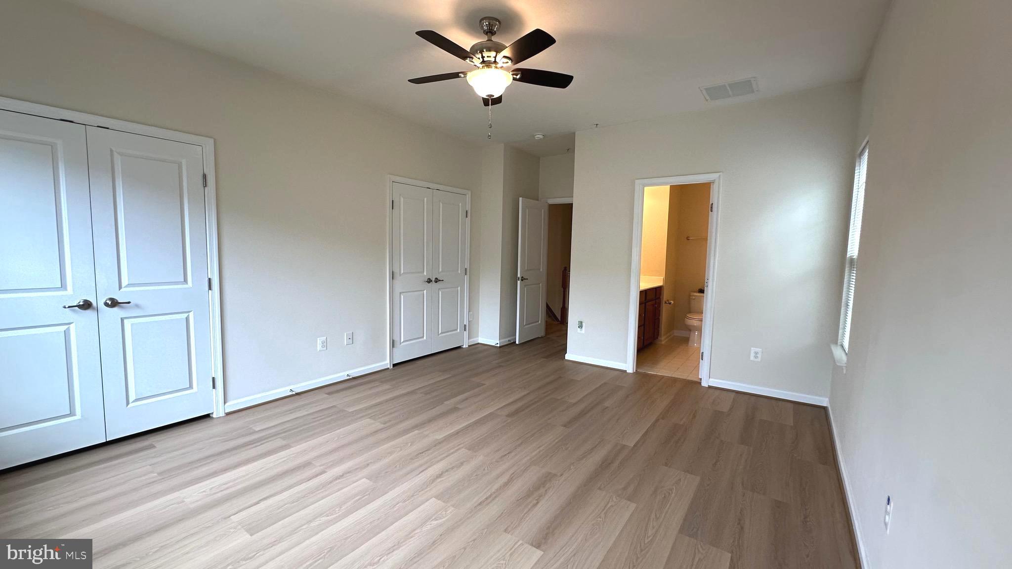 7343 Old Calvary Road Hanover, MD 21076 - Photo 23 of 35 a view of empty room with wooden floor and fan