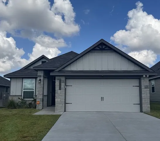 a house with yard in front of it