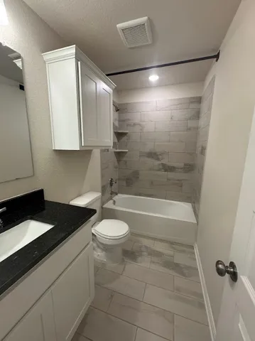 a view of walk in closet with stairs