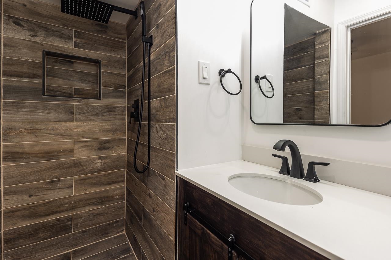 4771 Sea Isle Road Memphis, TN 38117 - Photo 7 of 12 a bathroom with a sink and a shower