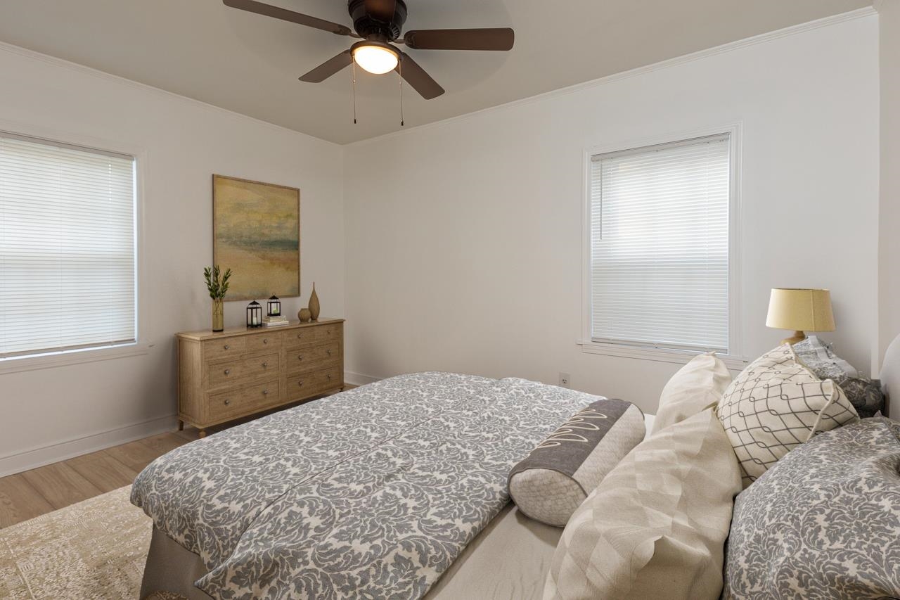 4771 Sea Isle Road Memphis, TN 38117 - Photo 8 of 12 a bedroom with a bed and wooden floor