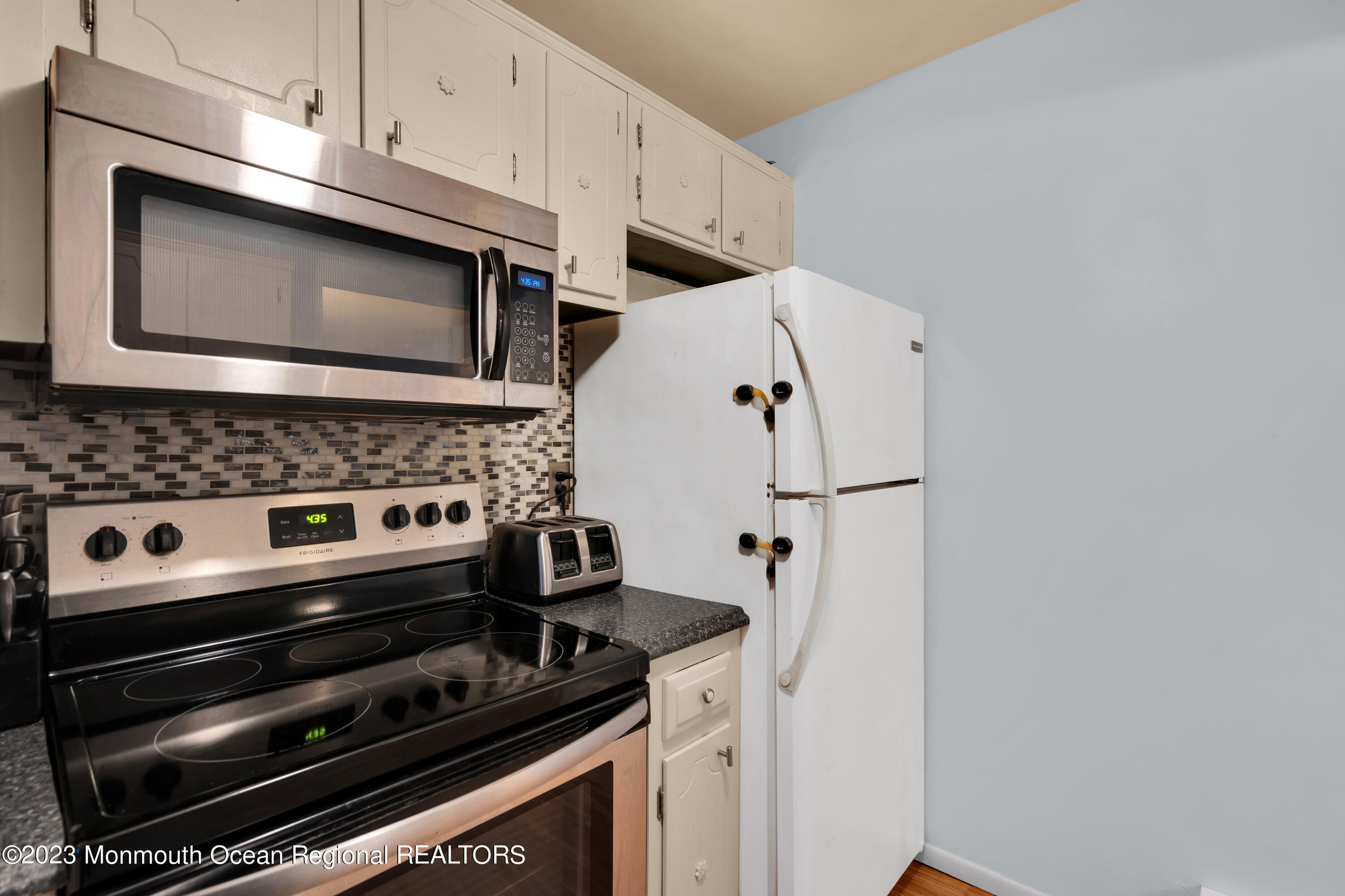 142 Azalea Drive, Unit B Whiting, NJ 08759 - Photo 16 of 27 a view of kitchen with microwave and stove