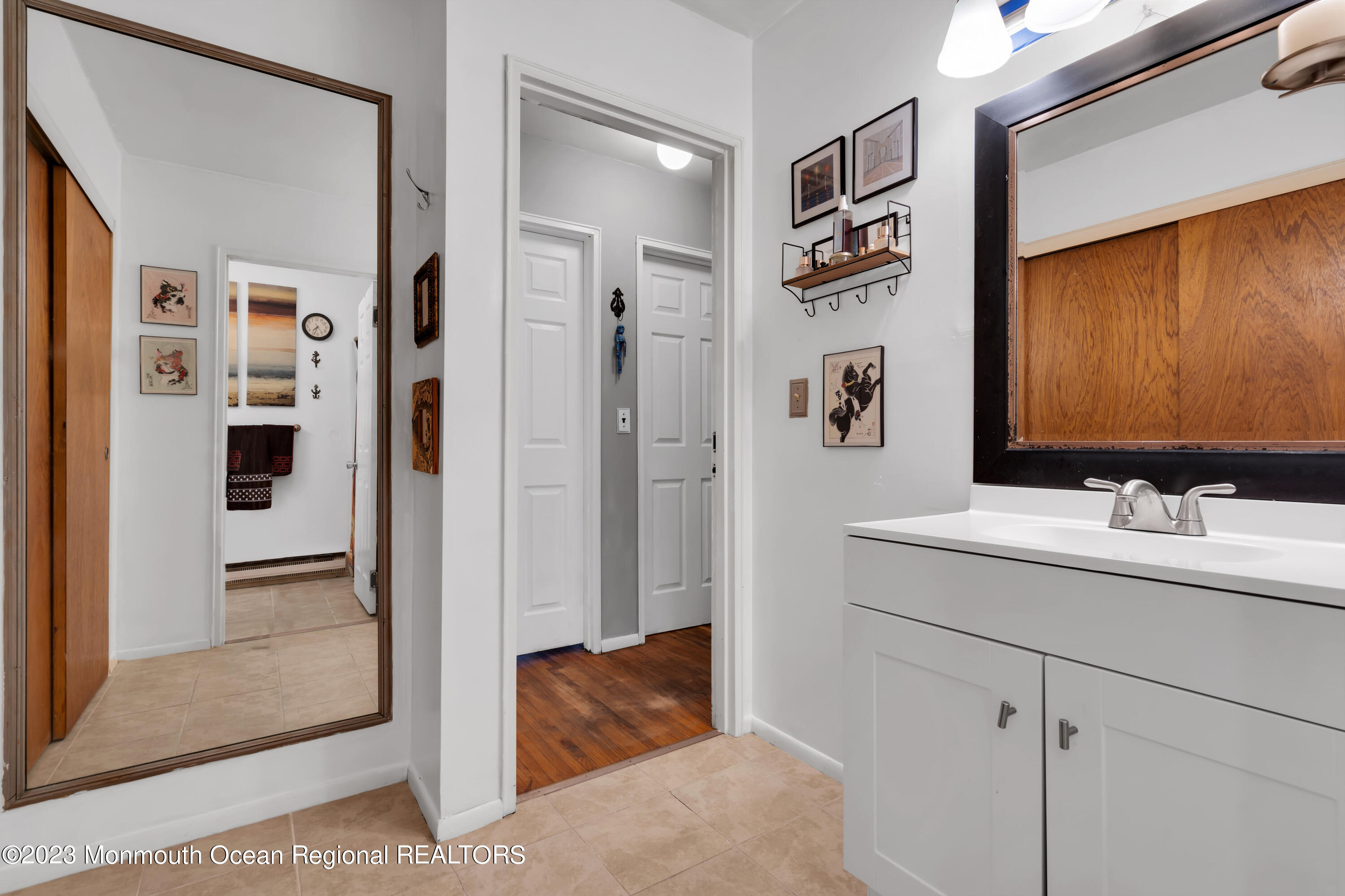 142 Azalea Drive, Unit B Whiting, NJ 08759 - Photo 18 of 27 a bathroom with a sink and a mirror