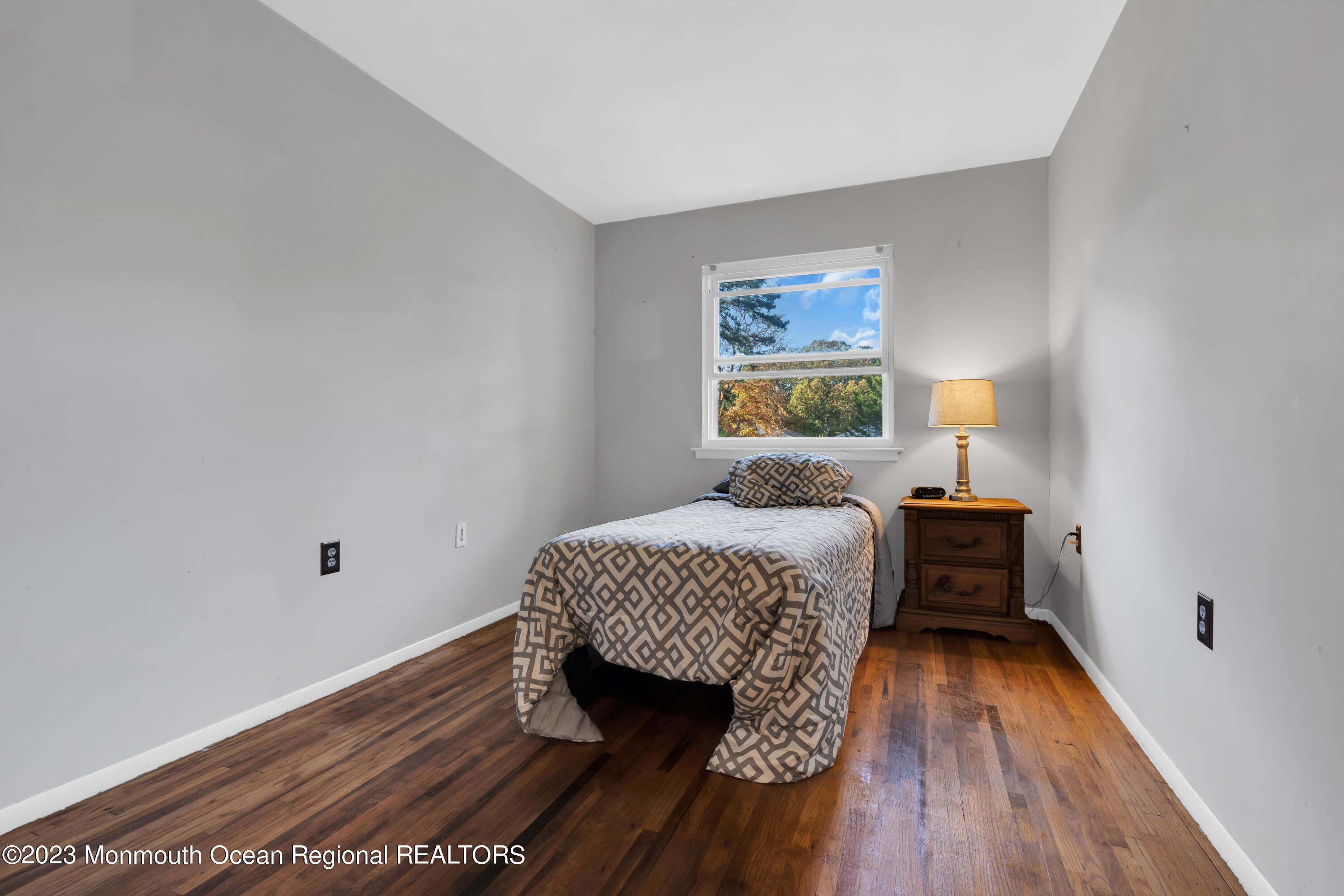 142 Azalea Drive, Unit B Whiting, NJ 08759 - Photo 20 of 27 a bedroom with a bed and a window