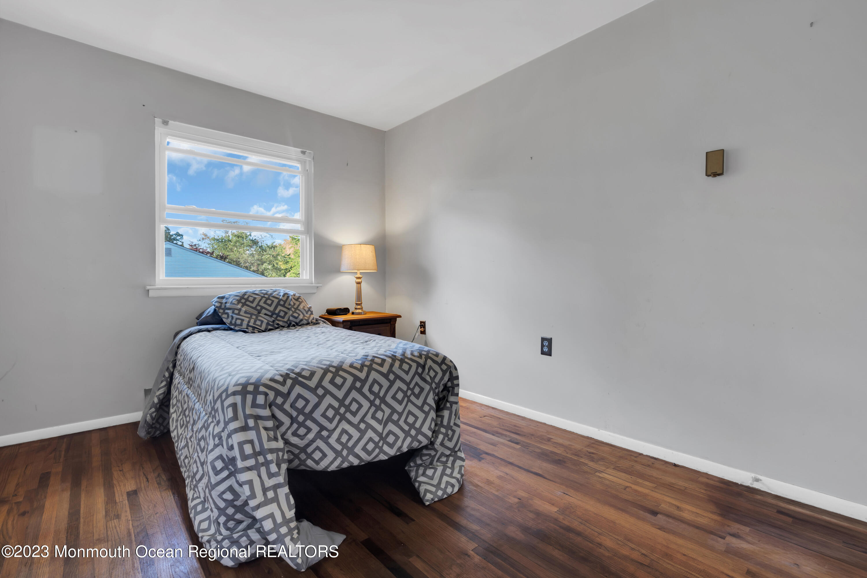 142 Azalea Drive, Unit B Whiting, NJ 08759 - Photo 21 of 27 a bedroom with a bed and a window