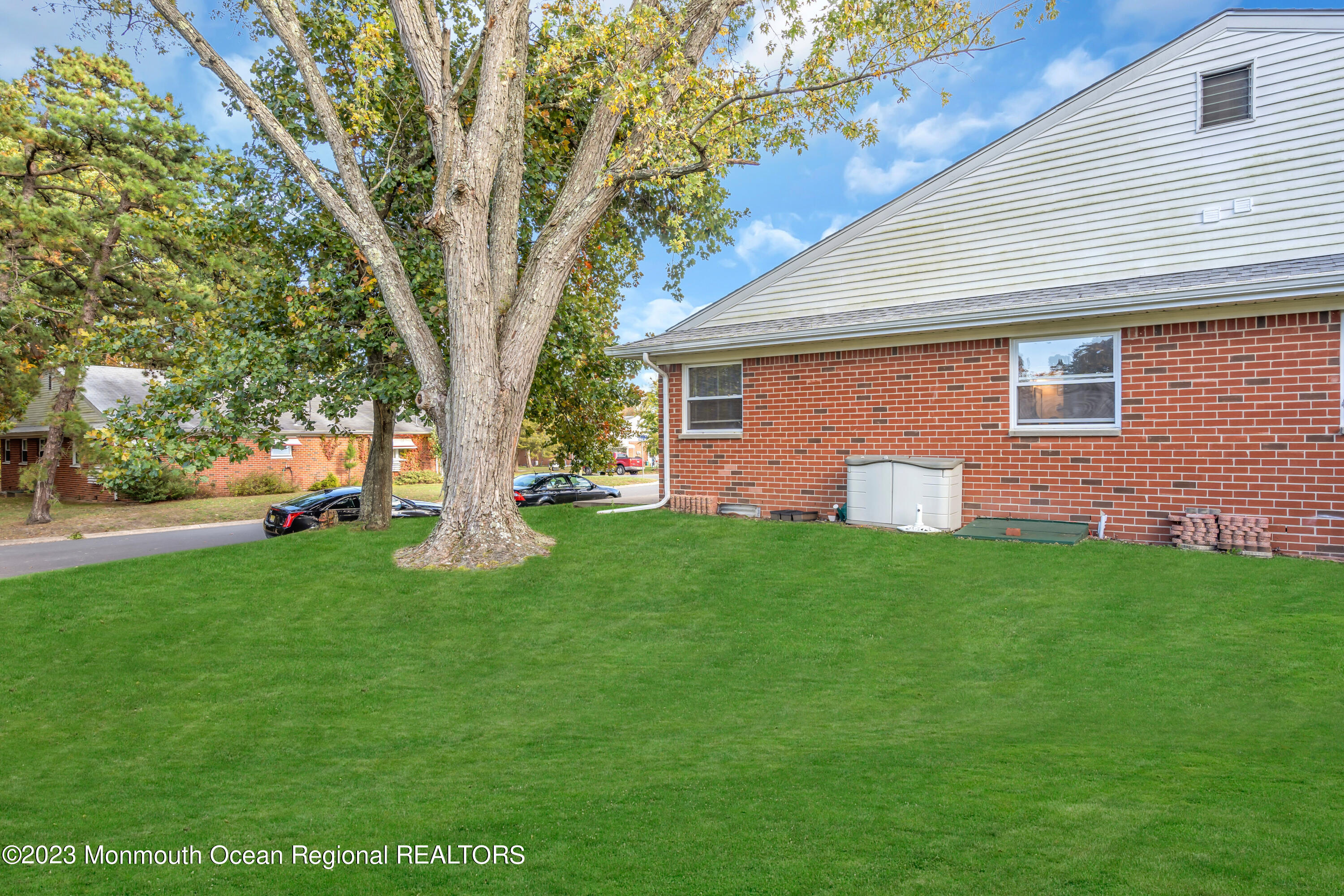 142 Azalea Drive, Unit B Whiting, NJ 08759 - Photo 26 of 27 a front view of house with yard and green space