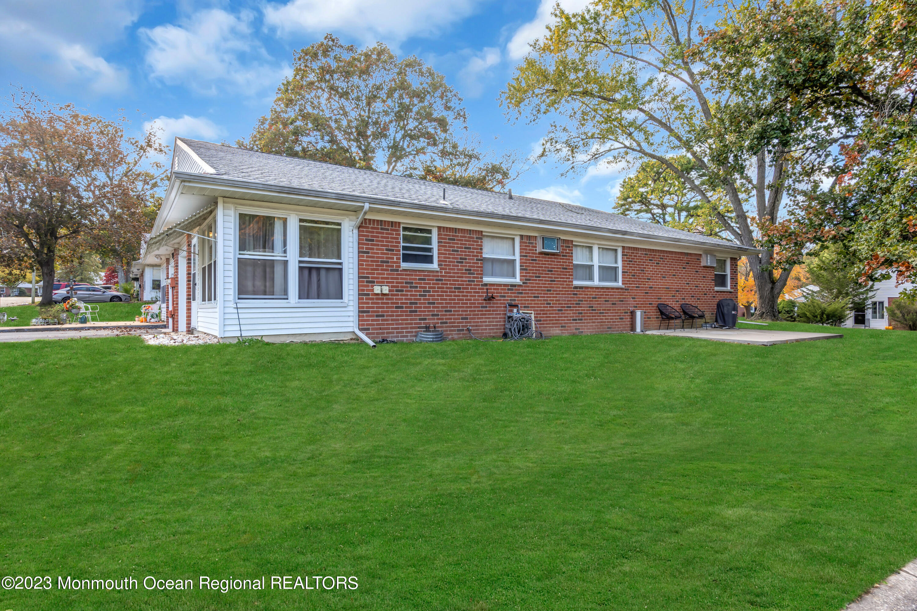 142 Azalea Drive, Unit B Whiting, NJ 08759 - Photo 27 of 27 a front view of house with yard and green space