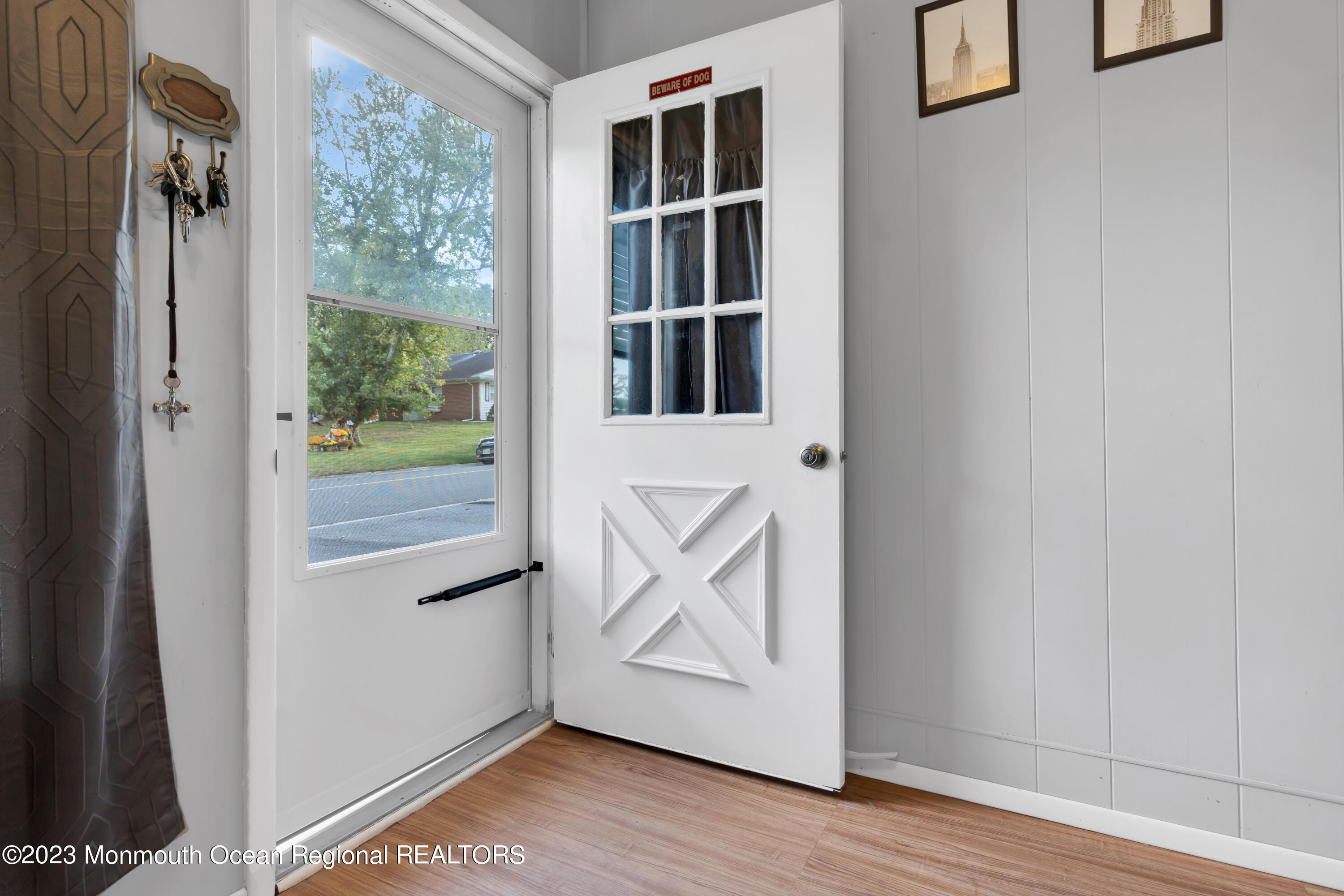 142 Azalea Drive, Unit B Whiting, NJ 08759 - Photo 6 of 27 a view of an entryway with wooden floor and door