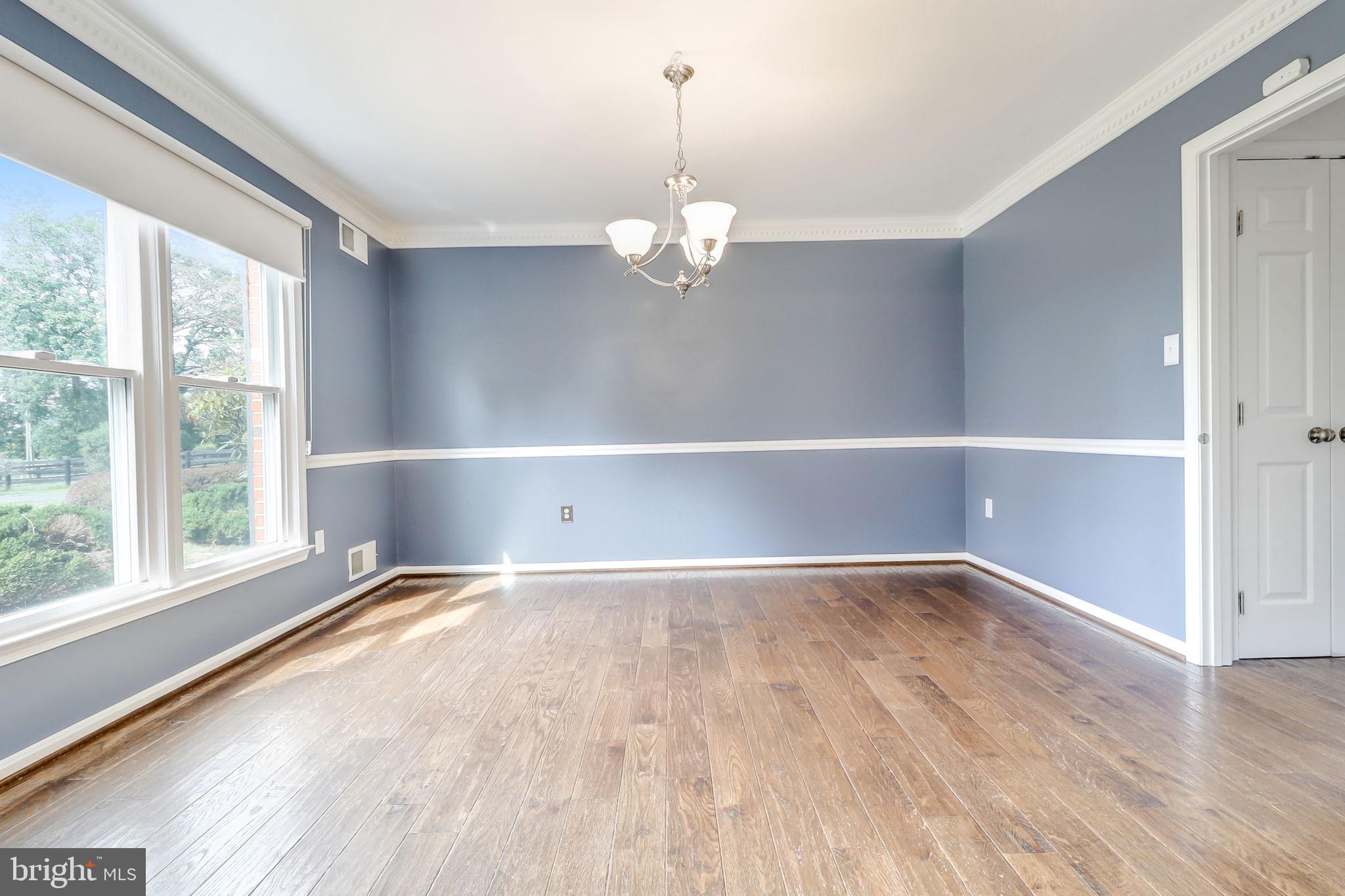 21960 Oatlands Road Aldie, VA 20105 - Photo 34 of 79 a view of an empty room with a window and wooden floor